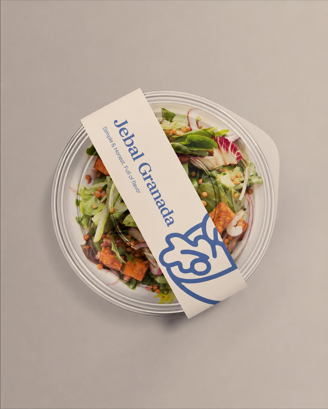 Jebal Granada packaging tag on a fresh salad bowl